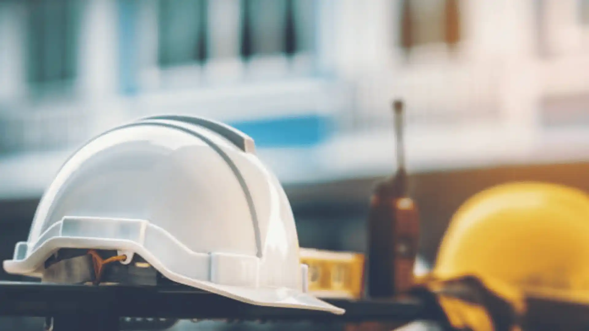 An Image of a Hard Hat on a Beam with a Blurred Background